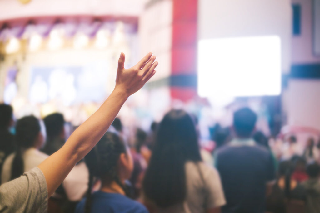 Person praising at church